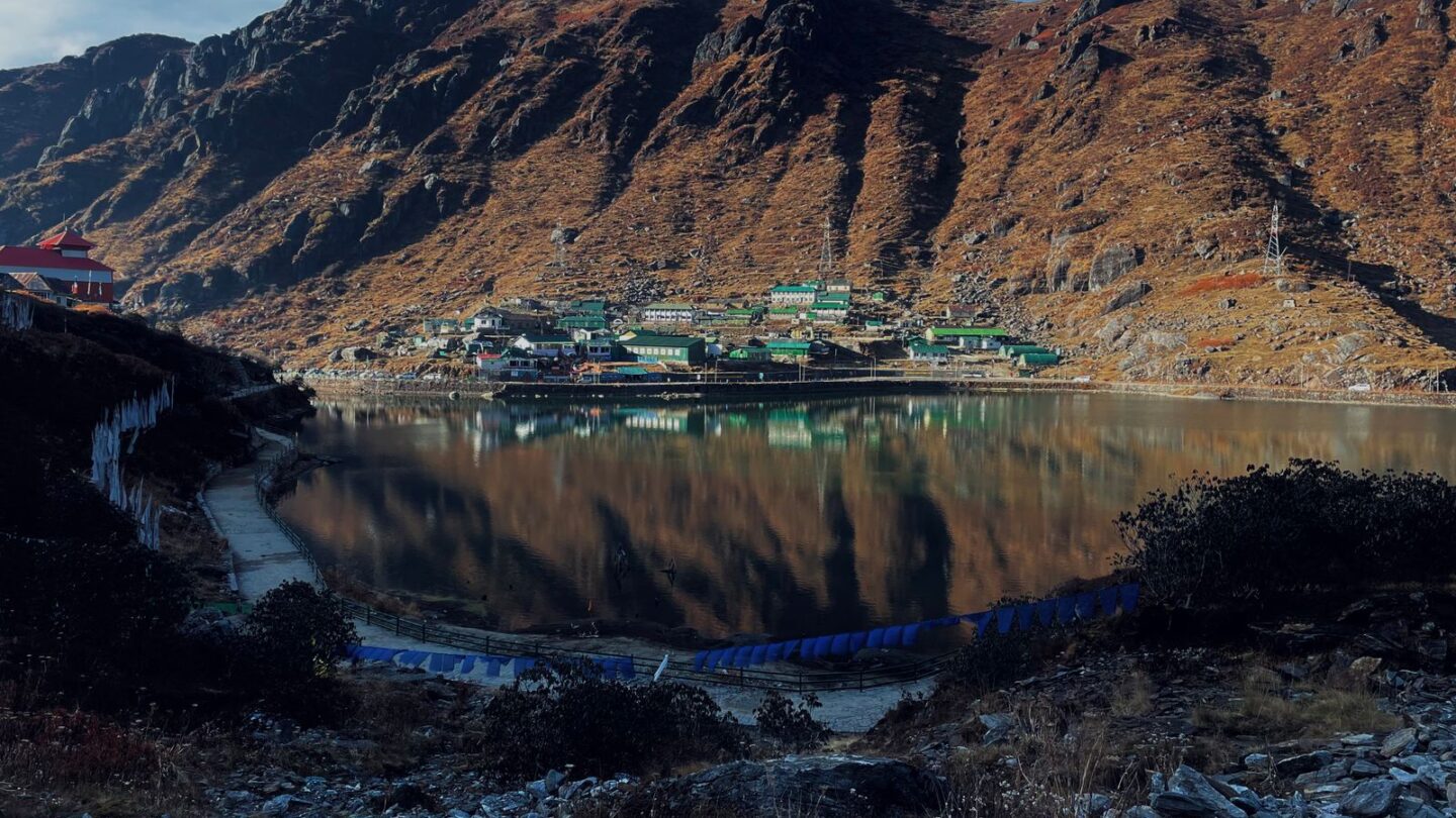 Best time to visit Northeast India shown by Tsomgo Lake and mountains in East Sikkim