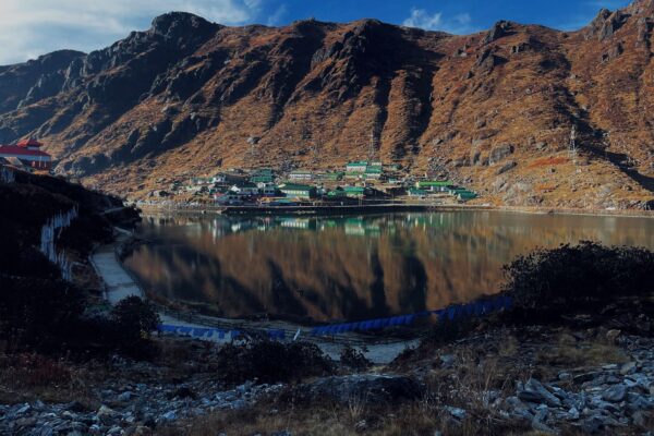 Best time to visit Northeast India shown by Tsomgo Lake and mountains in East Sikkim