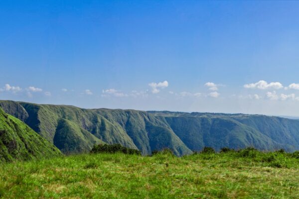 Seven Sisters of India landscape of green hill ranges in Meghalaya under a blue sky