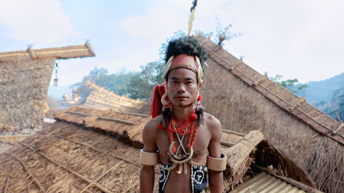 Man in tribal attire in a Nagaland village, home of the fermented soybean axone
