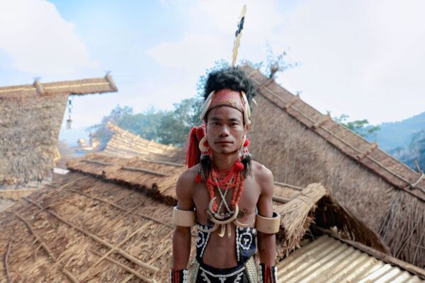Man in tribal attire in a Nagaland village, home of the fermented soybean axone