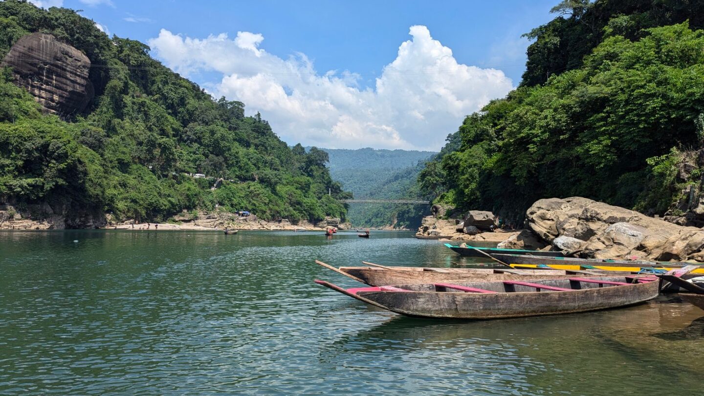 Dawki boats floating on the clear turquoise Umngot River in Meghalaya