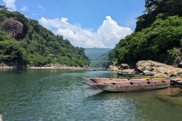 Dawki boats floating on the clear turquoise Umngot River in Meghalaya