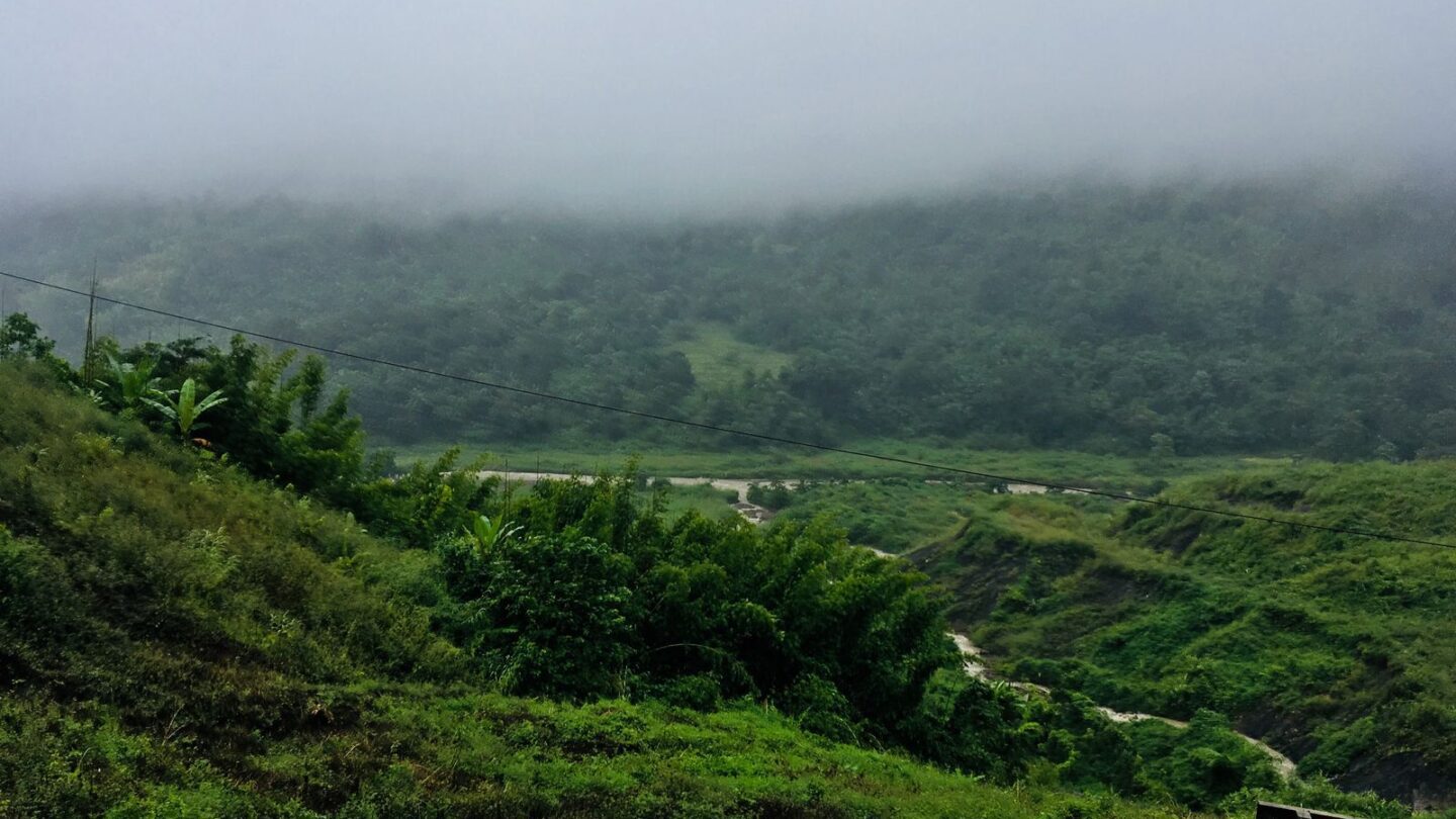 Misty green hills of Karbi Anglong, the largest of the districts of Assam by area