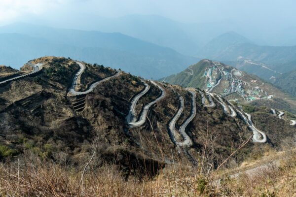 Serpentine hairpin road loops near Zuluk on the Old Silk Route in East Sikkim